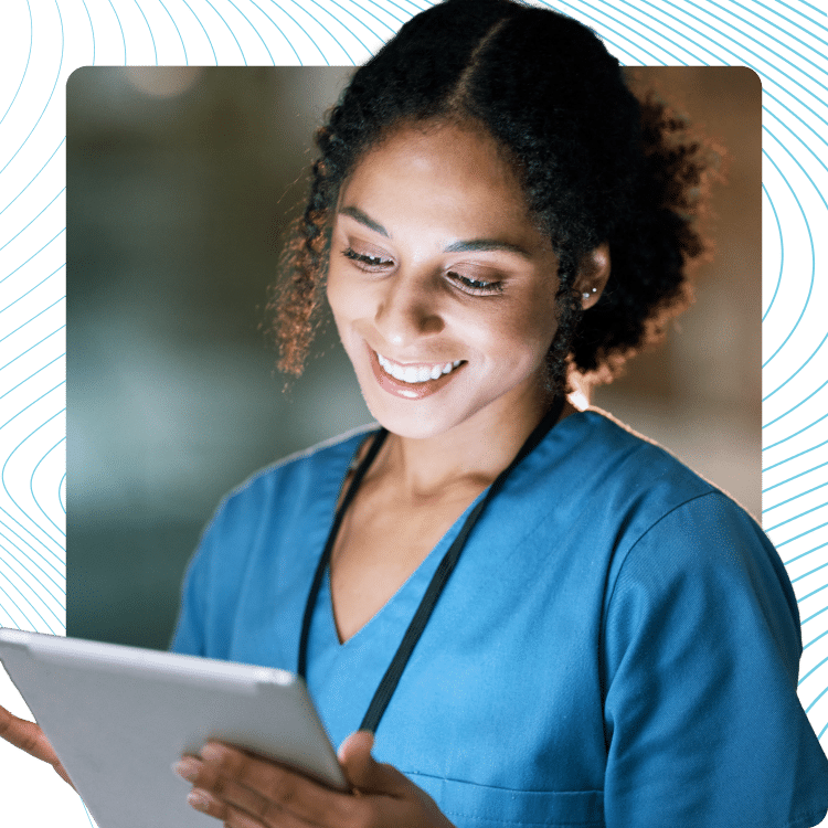 Nurse checking a patient chart on a tablet at the bedside
